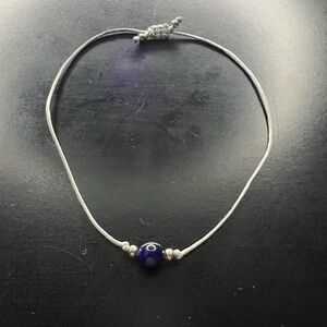 Blue tigers, eyes, silver cord bracelet